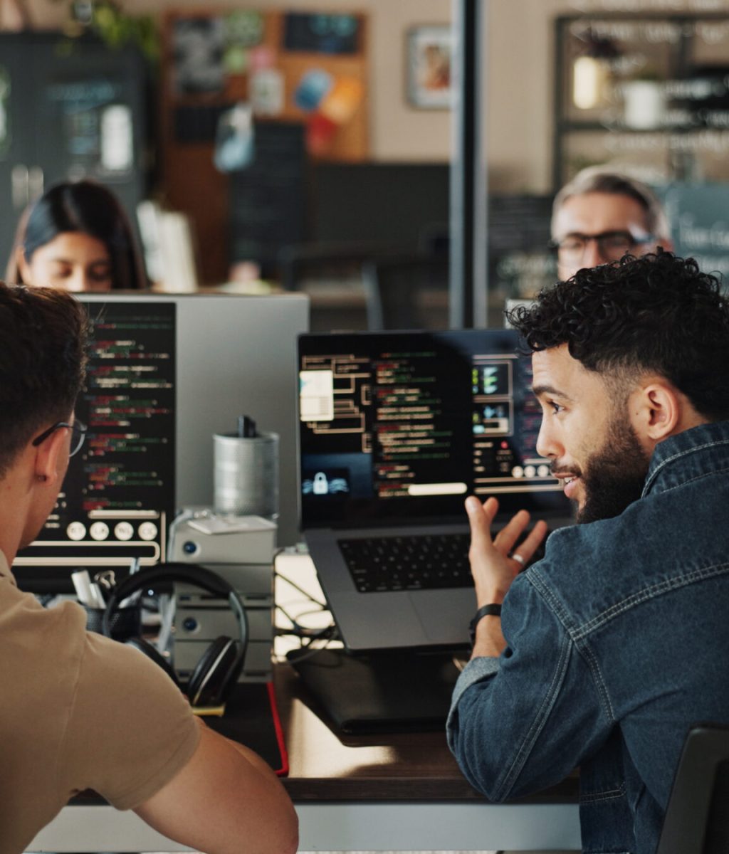 Man, developer and help with coding on computer screen in office for testing web application or tro.