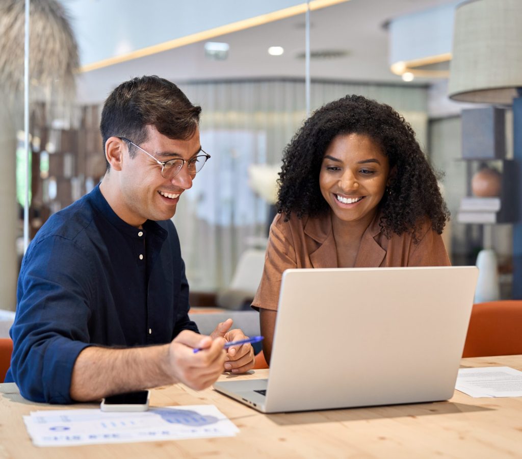 Smiling,Team,Professional,Employees,Working,Together,On,Computer,Discussing,Online