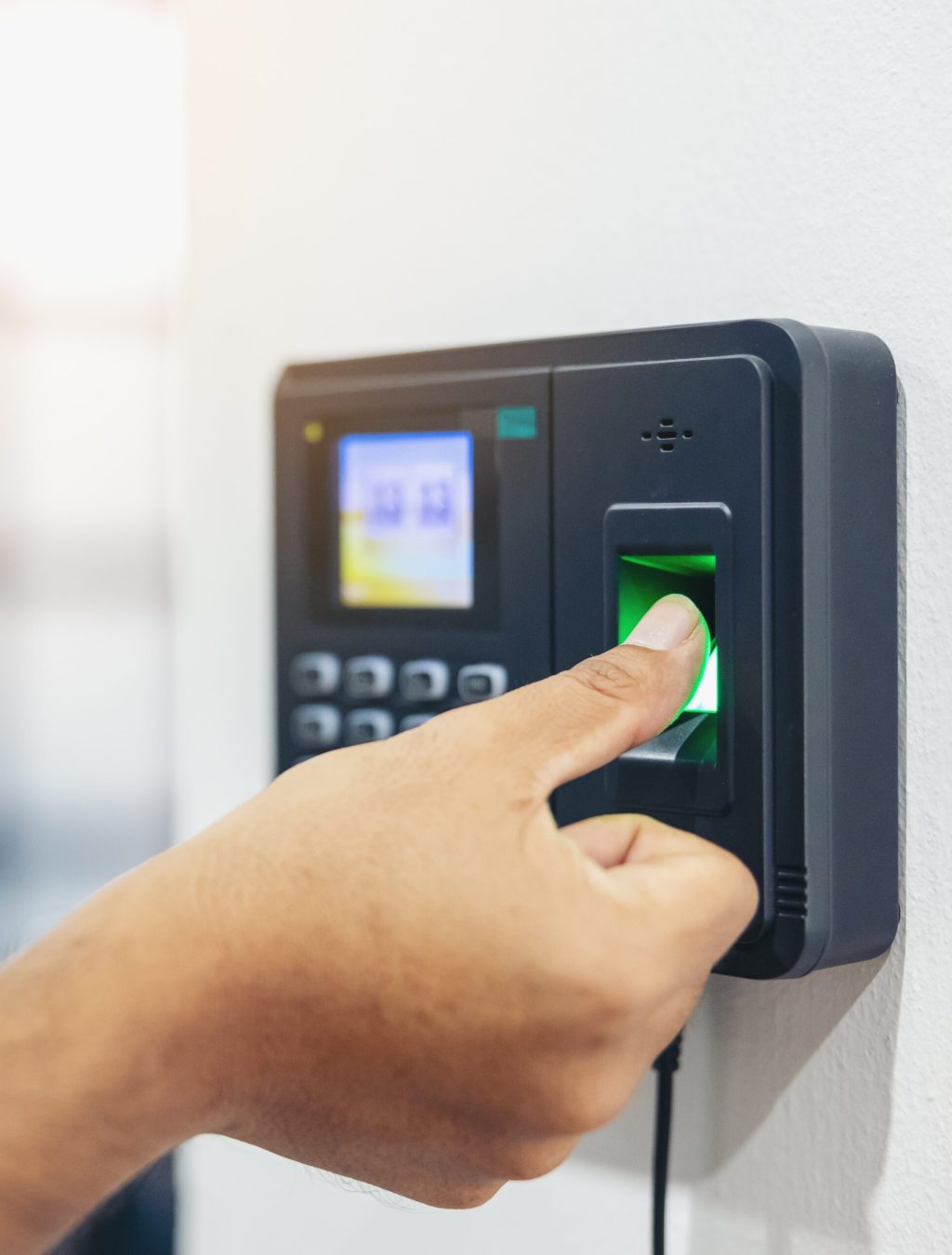 Finger print scan, Male employees press sensors to record company attendance time and after work, Time Recorder Attendance - Out work, Encryption for identity verification or electronic signing